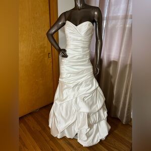 Stunning soft white fit and flare wedding dress by Winnie Couture.